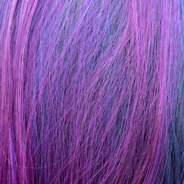 background from blue and pink colored hairs close up