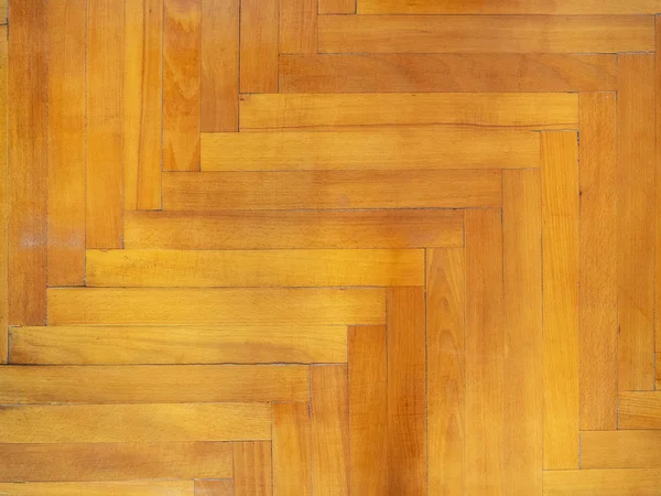 old parquet from oak wood with herringbone pattern laying