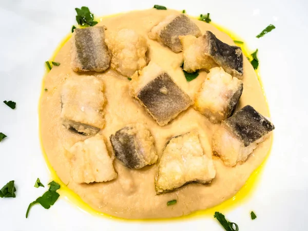 top view pieces of Baccala (salt cod) with cream