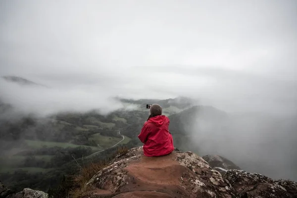 person high on the mountain celebrating sunrise