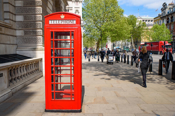 Red telephone box on the street in London, United Kingdom