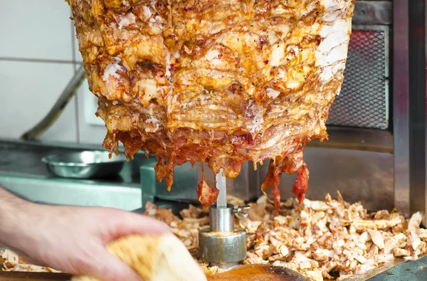 stock image A chef cutting traditional Turkish food Doner Kebab in a street food shop. Street food in Istanbul.