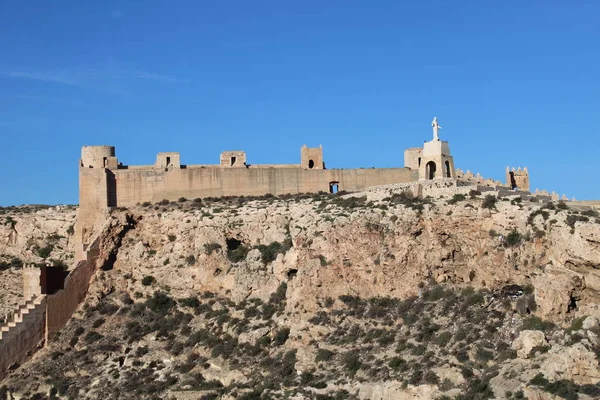 Hill with ancient castle on top in a city of Spain