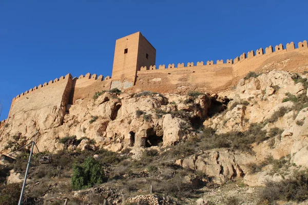 Hill with ancient castle on top in a city of Spain