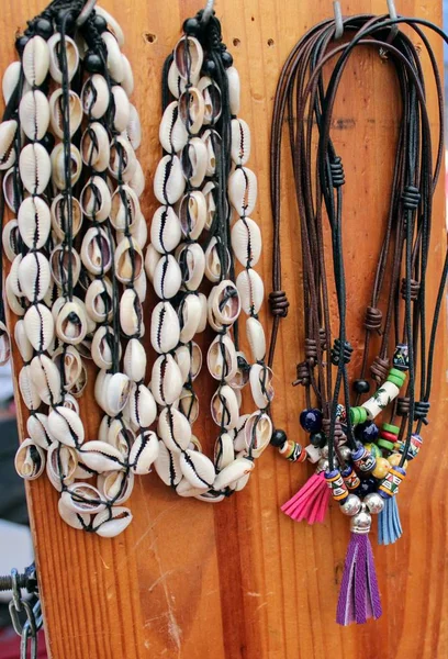 Braided leather necklaces and shells