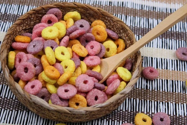 Bowl with colorful round cereals