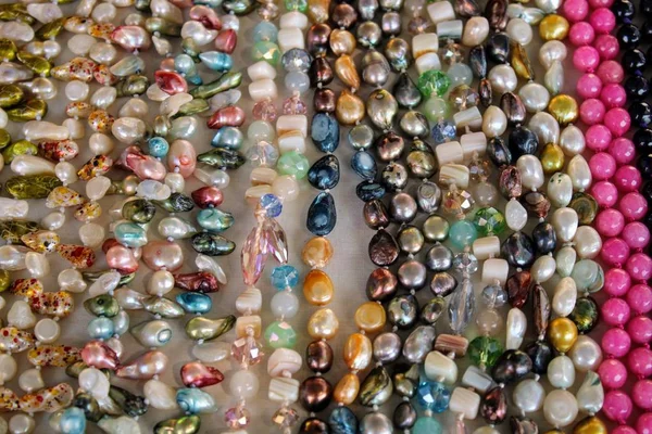 Necklaces of gems of different colors — Stock Photo, Image