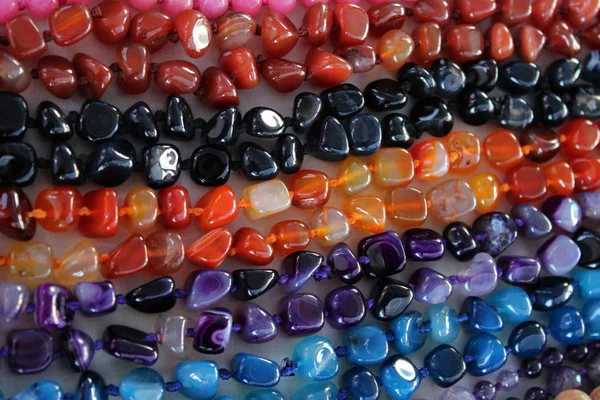 Necklaces of gems of different colors — Stock Photo, Image