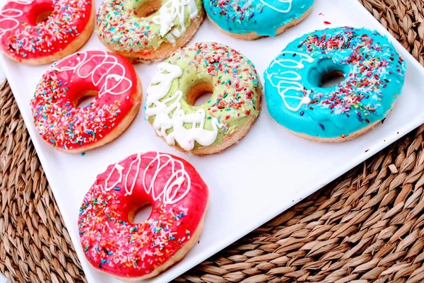 Delicious donuts with colorful chocolate — Stock Photo, Image