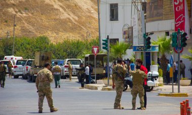 Kurdish Peshmerga soldiers & Police outside Erbil Governorate building under Islamic State attack in Iraqi-Kurdistan on 23rd July 2018. Kurdish security forces neutralized all three Daesh terrorists. clipart