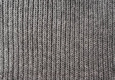 Yünlü bir kazak ya da sıcak bir eşarp gibi gri örülmüş bir doku. Örgü tipi - çorap.