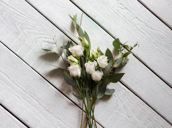 delicate bouquet with white roses and eucalyptus