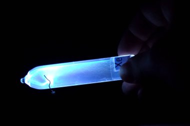 Xenon in vitro glows under influence of electricity. Laboratory Tests clipart