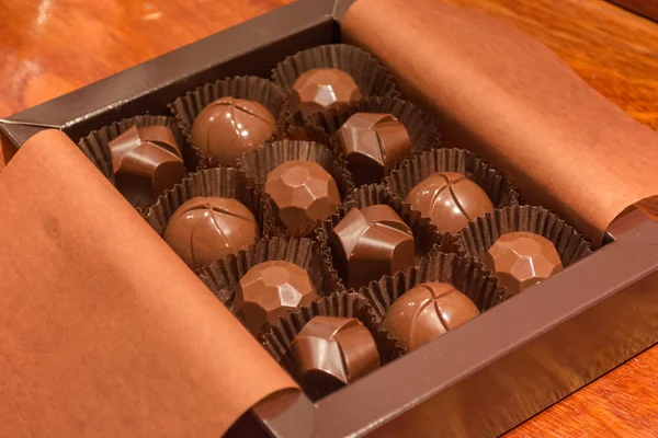 Open box of filled chocolate. Making homemade artisan chocolate sweets with different fillings for a special ocassion: valentine's day, a birthday or anniversary gift or the perfect souvenir
