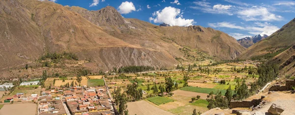 View from Pumatallis terraces, in the Ollantaytambo archaeological site. Amazing panorama of the valley, the mountains and the inca trail. Beautiful travel destination in the Sacred Valley, Peru.