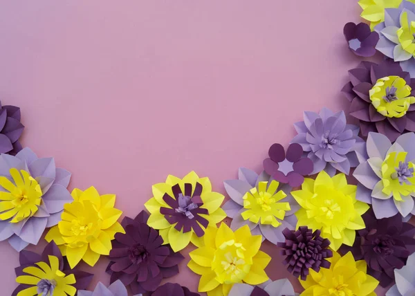 Paper craft Flower Decoration Concept. Flowers and leaves made of paper. Tropics. Pink background.