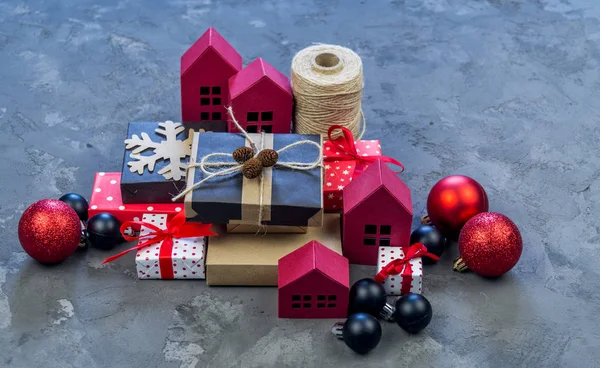 Packing a New Year\'s and Christmas gift kraft paper, red and black. Material for decorating the holiday. Natural decor in the style of eco-style.