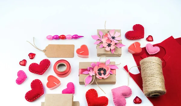 Gift wrapping for Valentine\'s day. Tools and decor for the holiday. Flower paper hack. Romantic setting. A gift with love.