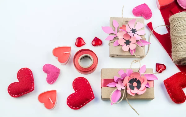 Gift wrapping for Valentine's day. Tools and decor for the holiday. Flower paper hack. Romantic setting. A gift with love.