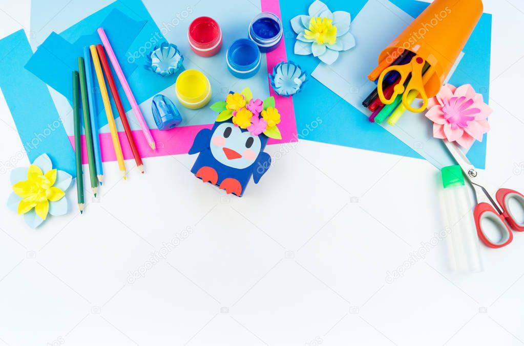Children's creativity. Materials for crafts from paper. Penguin box School and kindergarten. White background.