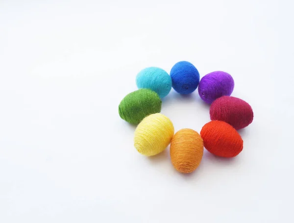 Easter eggs knitted from wool. Manual work. Rainbow. Easter. — Stock Photo, Image