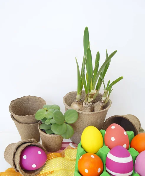 Decorative Easter composition. Birdhouse and Easter eggs. Flowerpots