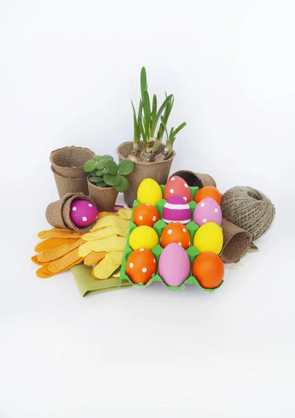 Decorative Easter composition. Birdhouse and Easter eggs. Flowerpots