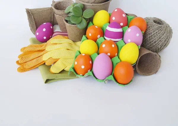 Decorative Easter composition. Birdhouse and Easter eggs. Flowerpots