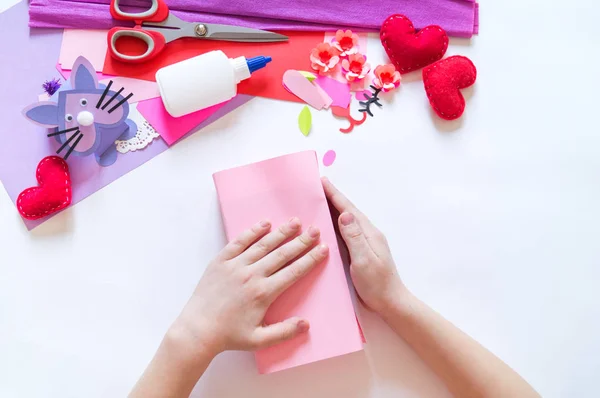 Child hands making a box rabbit. Holiday Easter light. Material for creative. hand people — Stock Photo, Image