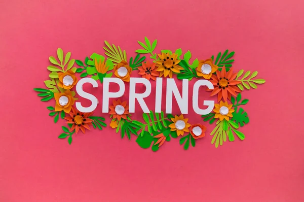 Spring hand lettering card. Spring tulip narcissus, plumeria paper flowers on dark pink background. — Stock Photo, Image