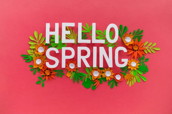 Hello Spring May hand lettering card. Spring tulip narcissus, plumeria paper craft flowers on dark pink background.