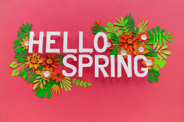 Hello Spring May hand lettering card. Spring tulip narcissus, plumeria paper craft flowers on dark pink background.