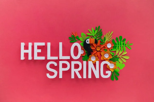 Hello Spring May hand lettering card. Spring tulip narcissus, plumeria paper craft flowers on dark pink background.