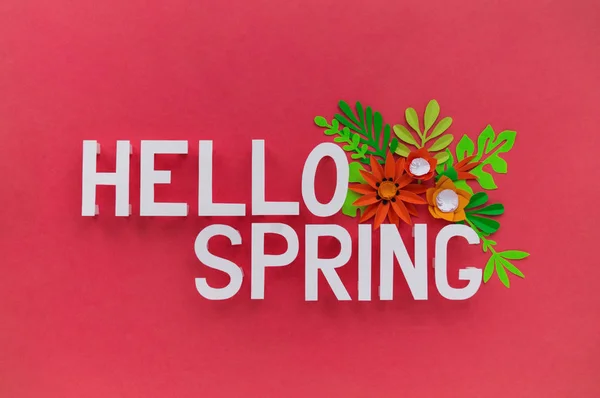 Hello Spring May hand lettering card. Spring tulip narcissus, plumeria paper craft flowers on dark pink background.