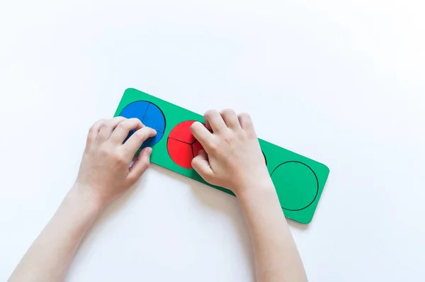 Montessori material. Children's hands. Whole and part. Fractions. The study of mathematics — Stock Photo, Image