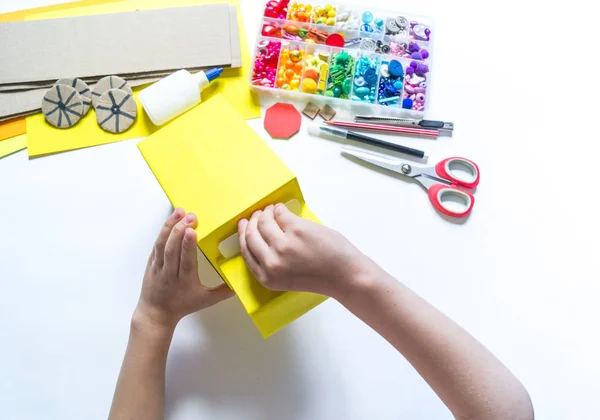 School bus made of cardboard. DIY children's pencil case for stationery paper craft. — Stock Photo, Image