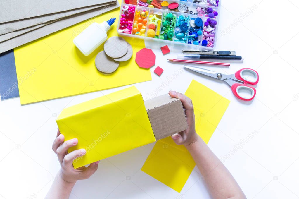 School bus made of cardboard. DIY children's pencil case for stationery paper craft.