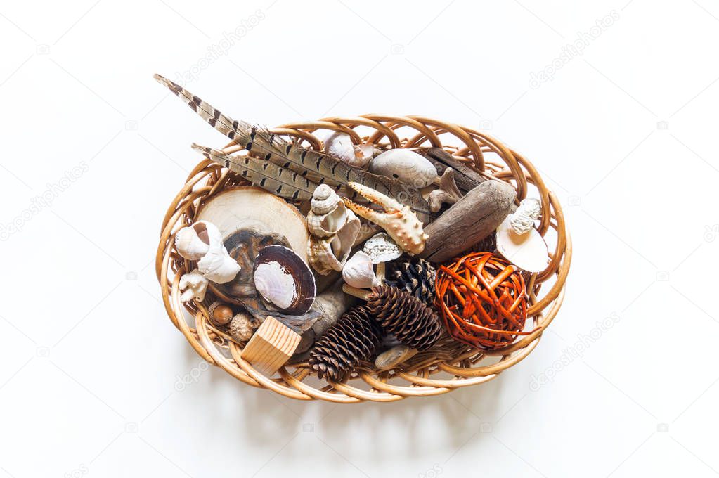 Natural material montessori training. Basket tray with objects for studying