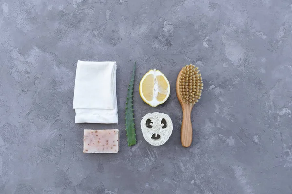 Set of Eco cosmetics products and tools. Zero waste, Plastic free. Sustainable lifestyle concept. Gray stone background Flat lay Copy space