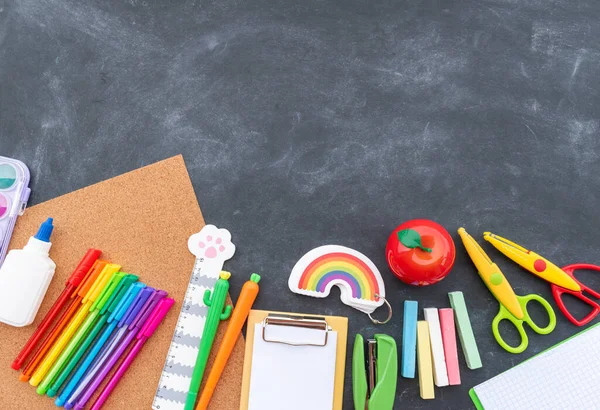 Stationery chalk board. Back to school. Copy space Flat lay