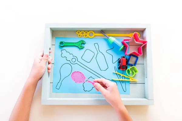 Montessori material sorting shape. Education at home. Lesson with children. White background.