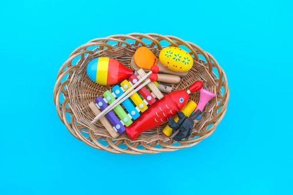 Montessori material musical instrument. Education at home. Lesson with children. Blue background.