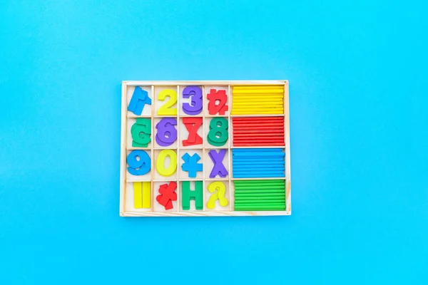 Montessori material sorting shape. Education at home. Lesson with children. Blue background.