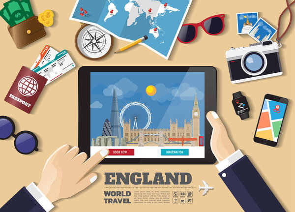 Hand holding smart tablet booking travel destination.England fam