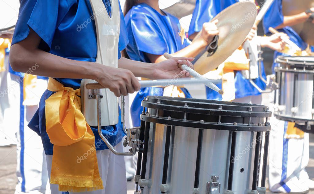 Closeup of group of boy and girl in Thai traditional uniform with drums. , snare drum