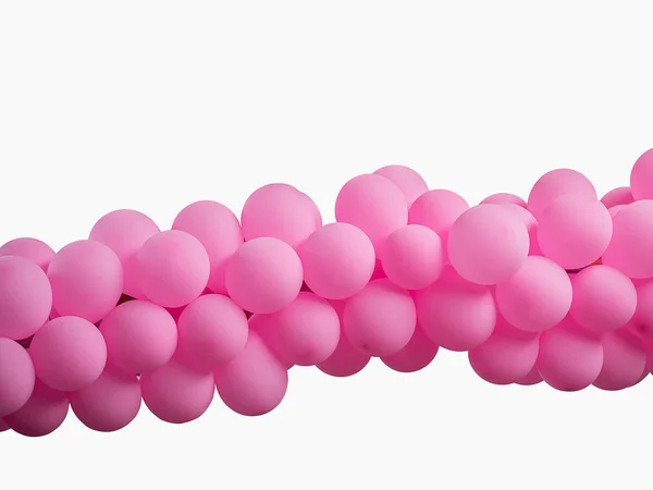 Růžové barvy, zdobené balónky v řadě nad bílým pozadím Stock Obrázky
