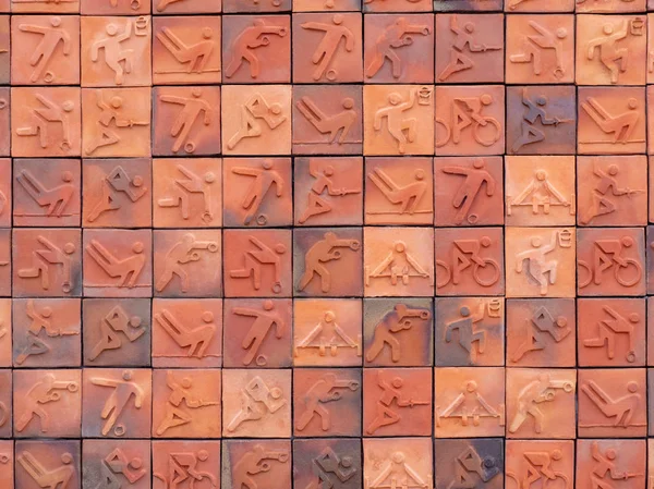 Bliska strzał symboli sportowych na tle mozaiki ceramicznej. — Zdjęcie stockowe