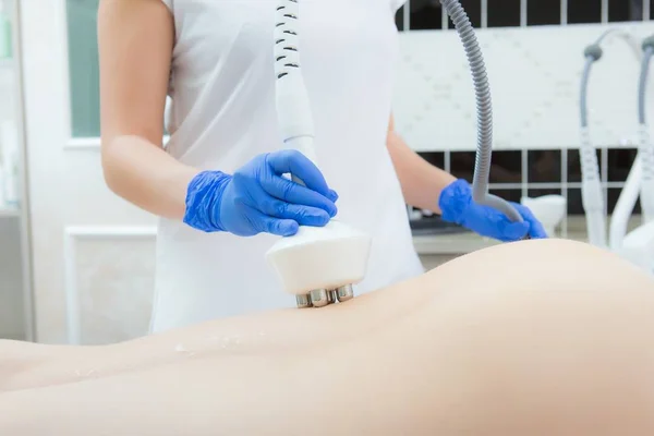 Hardware cosmetology. Woman anti-cellulite treatment at medical spa center. Woman getting anti cellulite massage in spa salon. Body contouring treatment in clinic. Beautician works in gloves