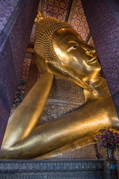 Wat Pho - The temple of the Reclining Buddha. 46 meters long gold plated Reclining Buddha The temple is famous for its enormous gold plated Reclining Buddha image. The image named Phra Phuttha Saiyat was build during the reign of King Rama III in 183