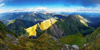 Breathtaking panoramic view of a mountain range, Ennstal Alps, Styria, Austria. Their peaks shrouded in mist. Rugged terrain in Austrian Alps. Wanderlust